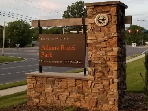 Monument sign for Adams Ricci Park Northwest Entrance near East Pennsboro Township and Mid State Baths.