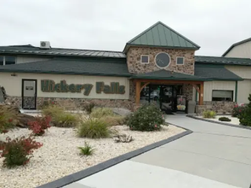 A welcoming building shows a Hickory Falls sign, with easy access to quality bathroom remodeling by Mid State Baths.