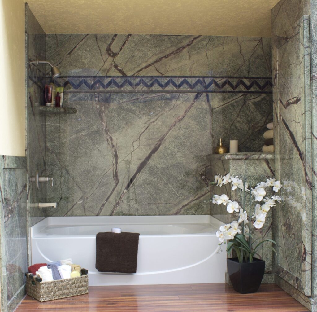 A peaceful, modern bathroom from Mid State Baths shows comfort and style with relaxing touches and organized essentials.