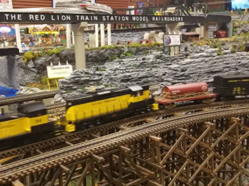 A model train display shows careful craftsmanship and attention to detail, similar to how Mid State Baths installs showers.